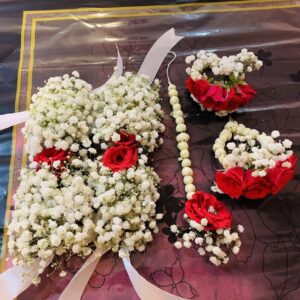 Red roses and white baby’s breath bridal flower jewellery set by Rukhsar Flowers