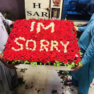 400 red roses bouquet with I'M SORRY written in white roses