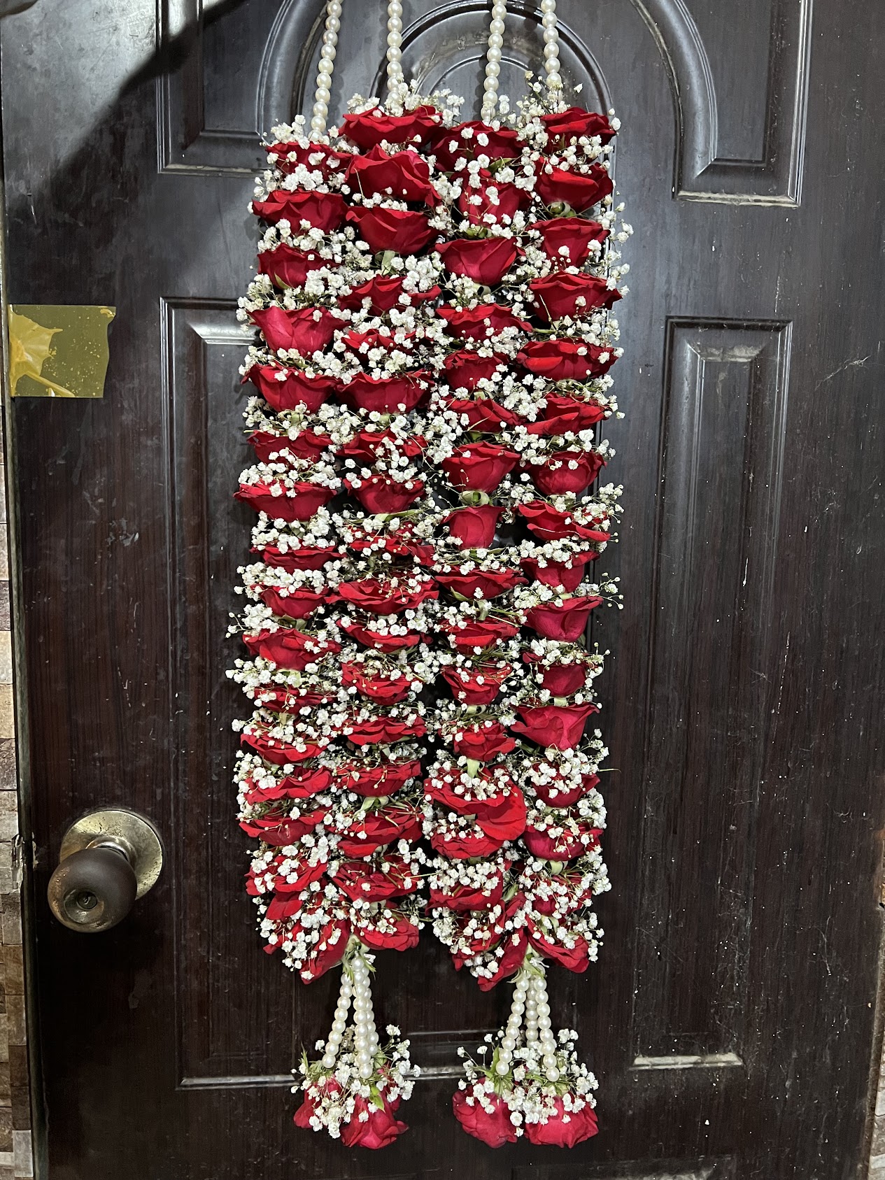 Elegant red roses haar with white baby’s breath for weddings in Karachi